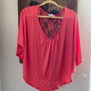 Peach lace blouse. Long front short back.